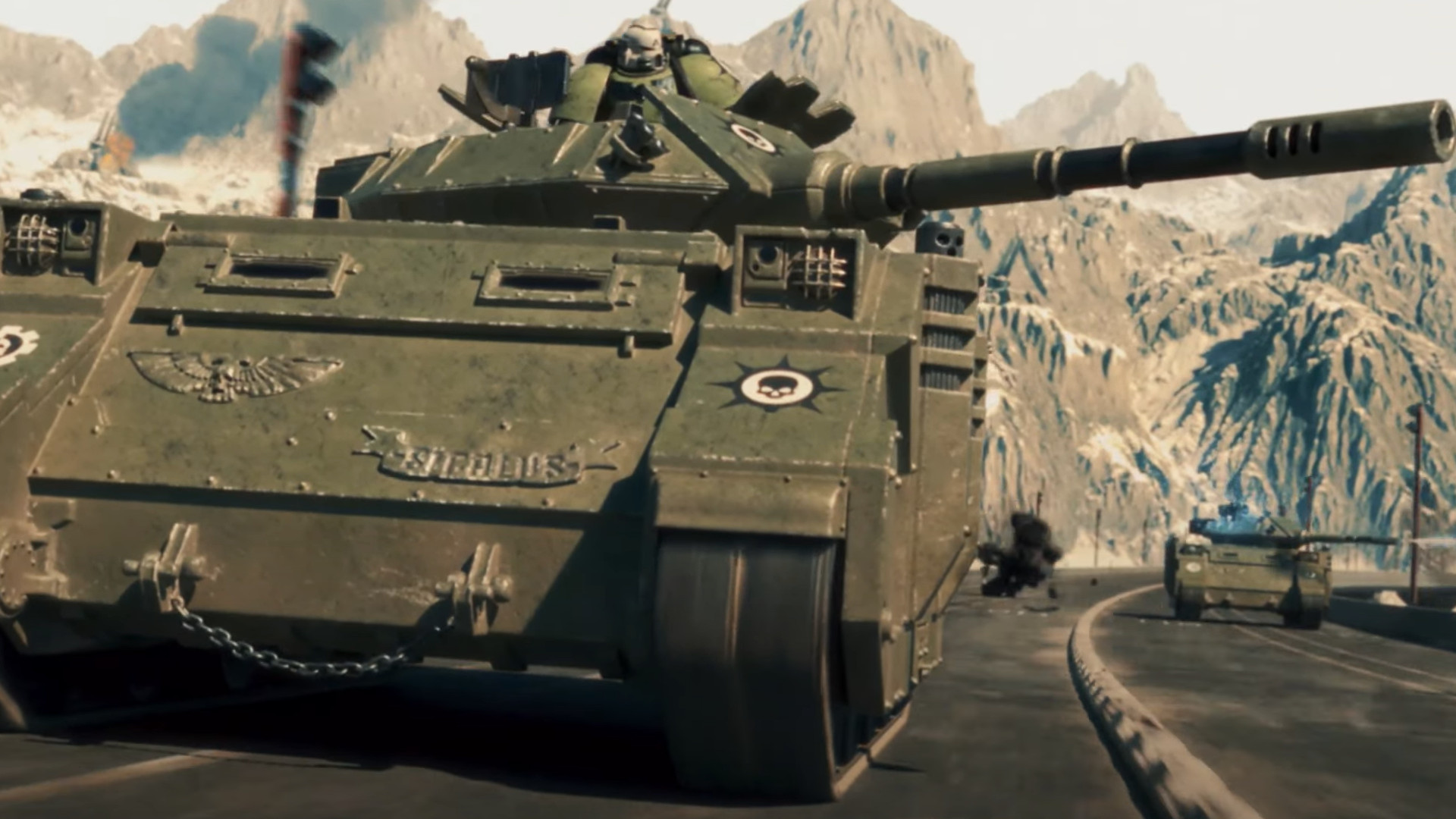A green Sons of Medusa Predator tank leading an armoured column along a mountain road