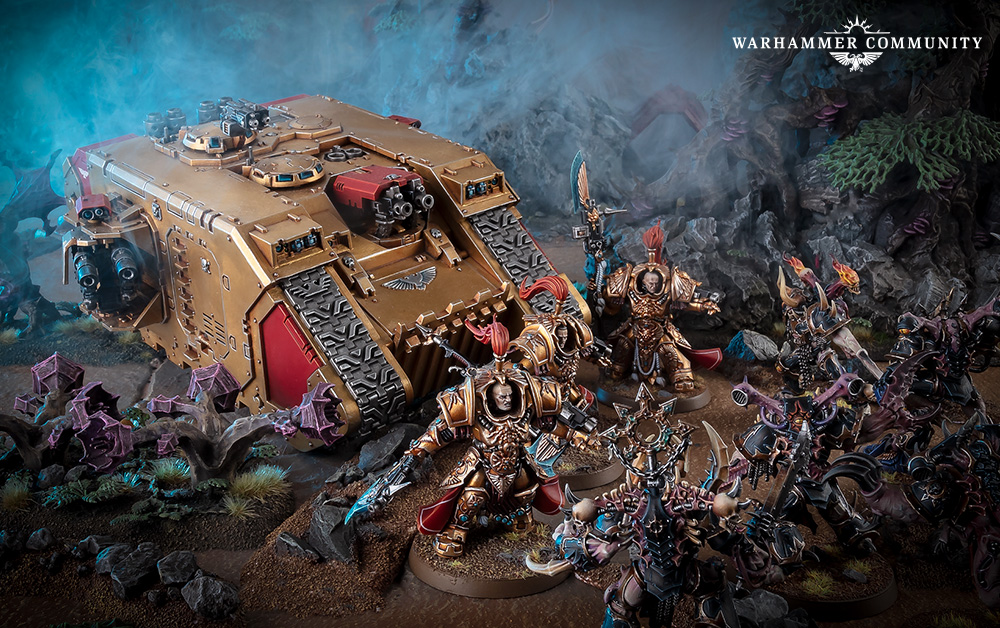 A Custodes Venerable Land Raider in gold and red with Custodians fighting Chaos Space Marines around it
