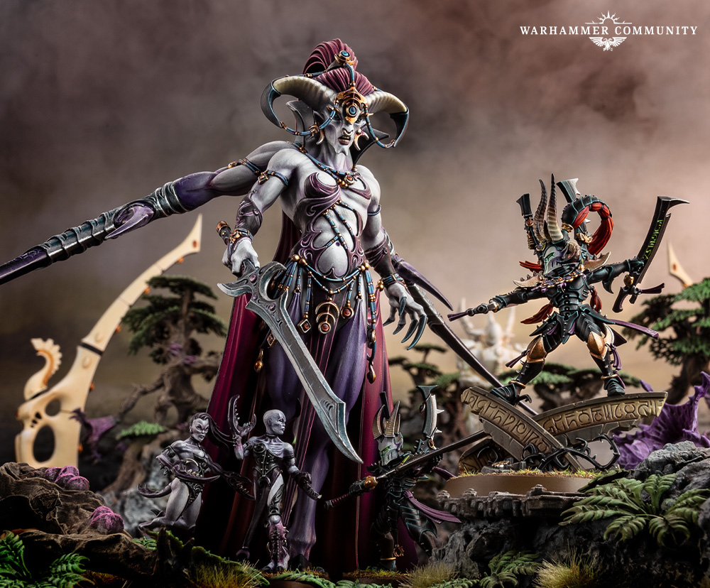 A Keeper of Secrets with Slaaneshi daemons in a Warhammer Community display