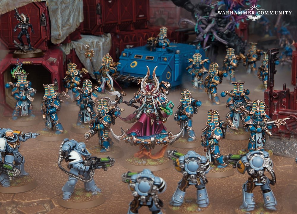 An Exalted Sorcerer of the Thousand Sons leading a host of Rubric Marines