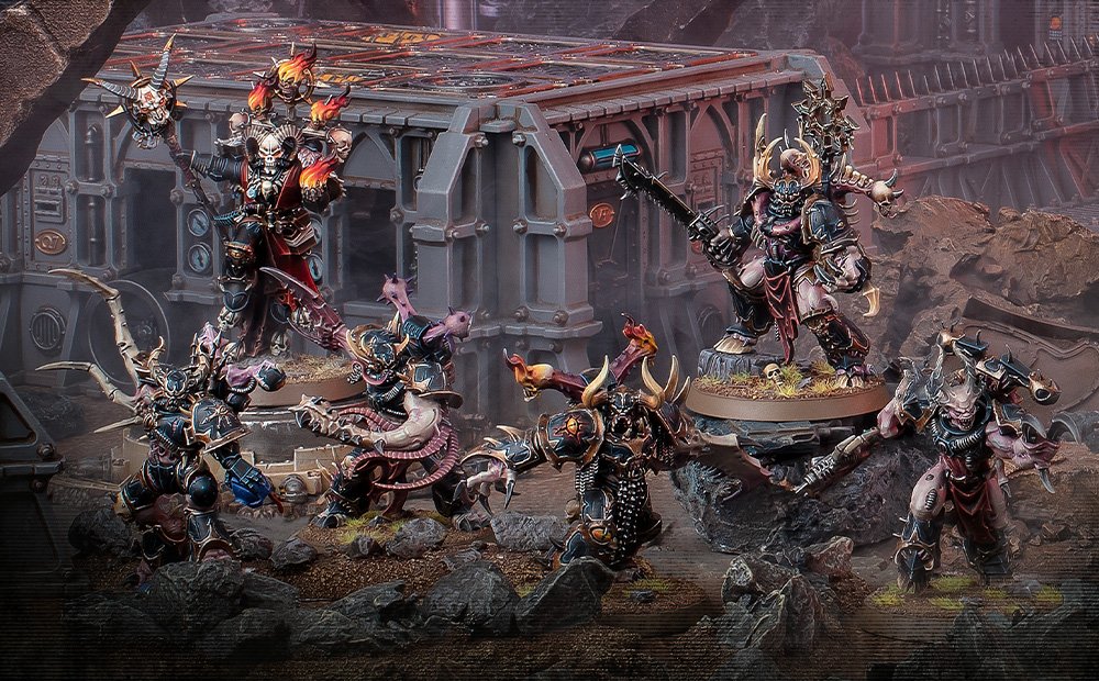 Word Bearers champions and Dark Apostles, their crimson armour hung with burning braziers, lead a Chaos warband through ruins