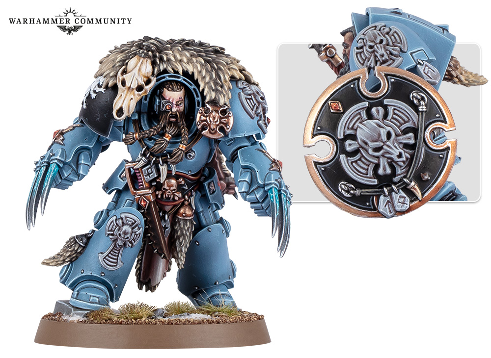 A Wolf Guard Terminator with paired lightning claws, a wolf-skull trophy and a decorated storm shield shown alongside him